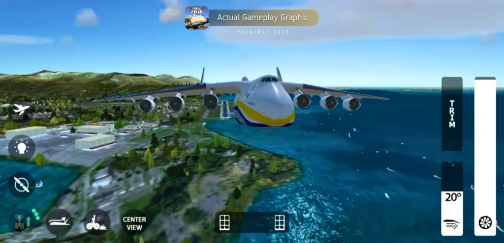 A mobile game screenshot from "Flight Simulator 2018 FlyWings." A large, six-engine Antonov An-225 Mriya cargo plane is the central focus, shown in flight above a realistic coastal landscape featuring several islands, a city with white buildings, and blue water. The sky is blue with scattered clouds.  At the very top of the image is a banner that reads "Actual Gameplay Graphic" and "FLY WINGS 2018."  On the right side of the screen are three vertical sliders, one labeled "TRIM", another displaying 20° wings and the other Throttles engine gear. At the bottom center of the screen is a rectangular button labeled "CENTER VIEW."  Other UI icons are visible at the bottom corners.  A smaller plane icon can be seen in the top left corner.